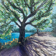 Pailette knife painting of a tree by a lake with a path leading through the foliage.