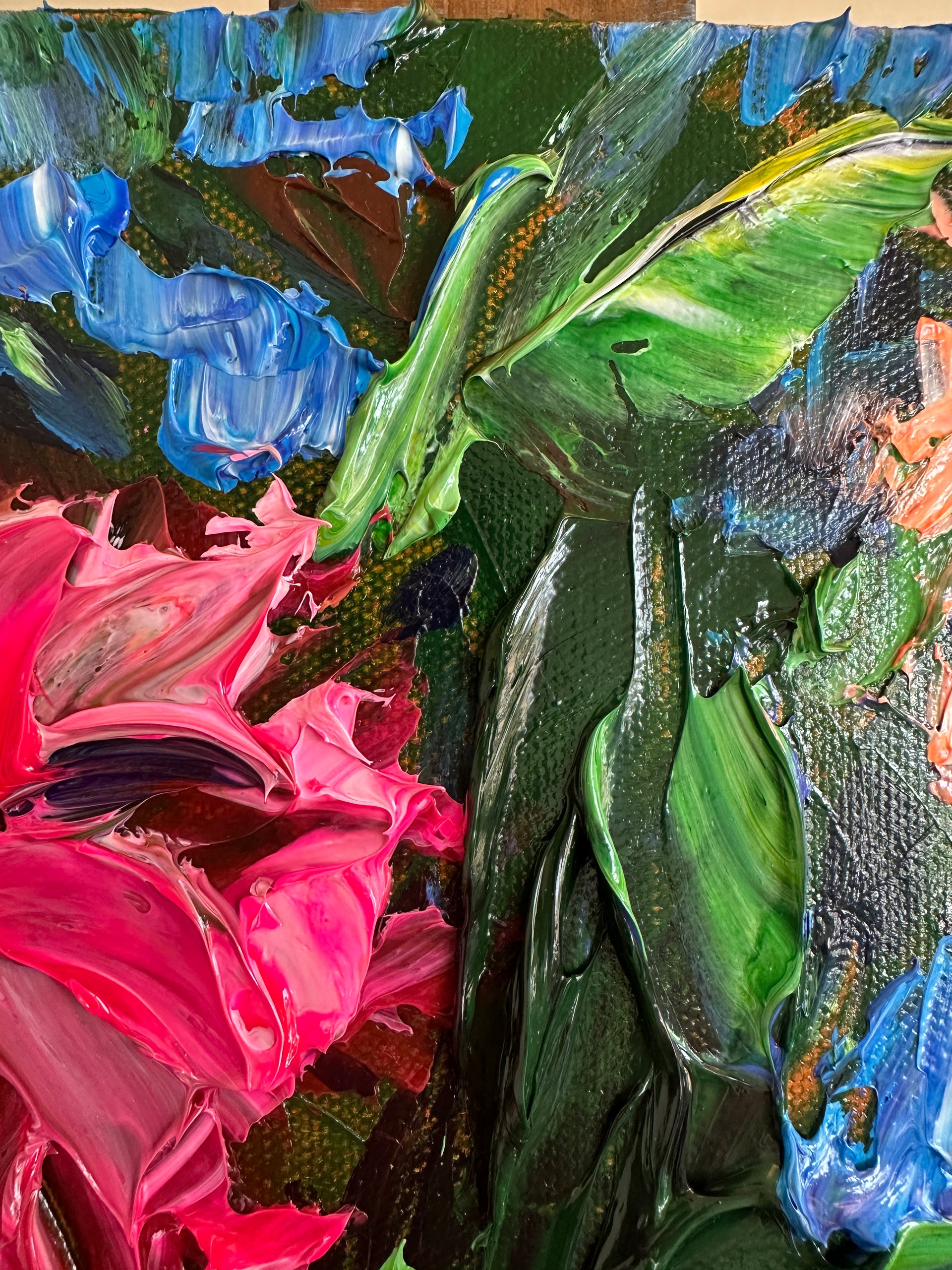 Close up palette knife painting with green, pink, and blue colors