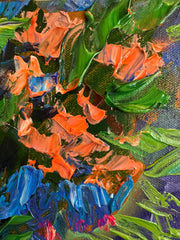 close up shot of palette knife impasto floral painting with green, blue, and orange brush strokes
