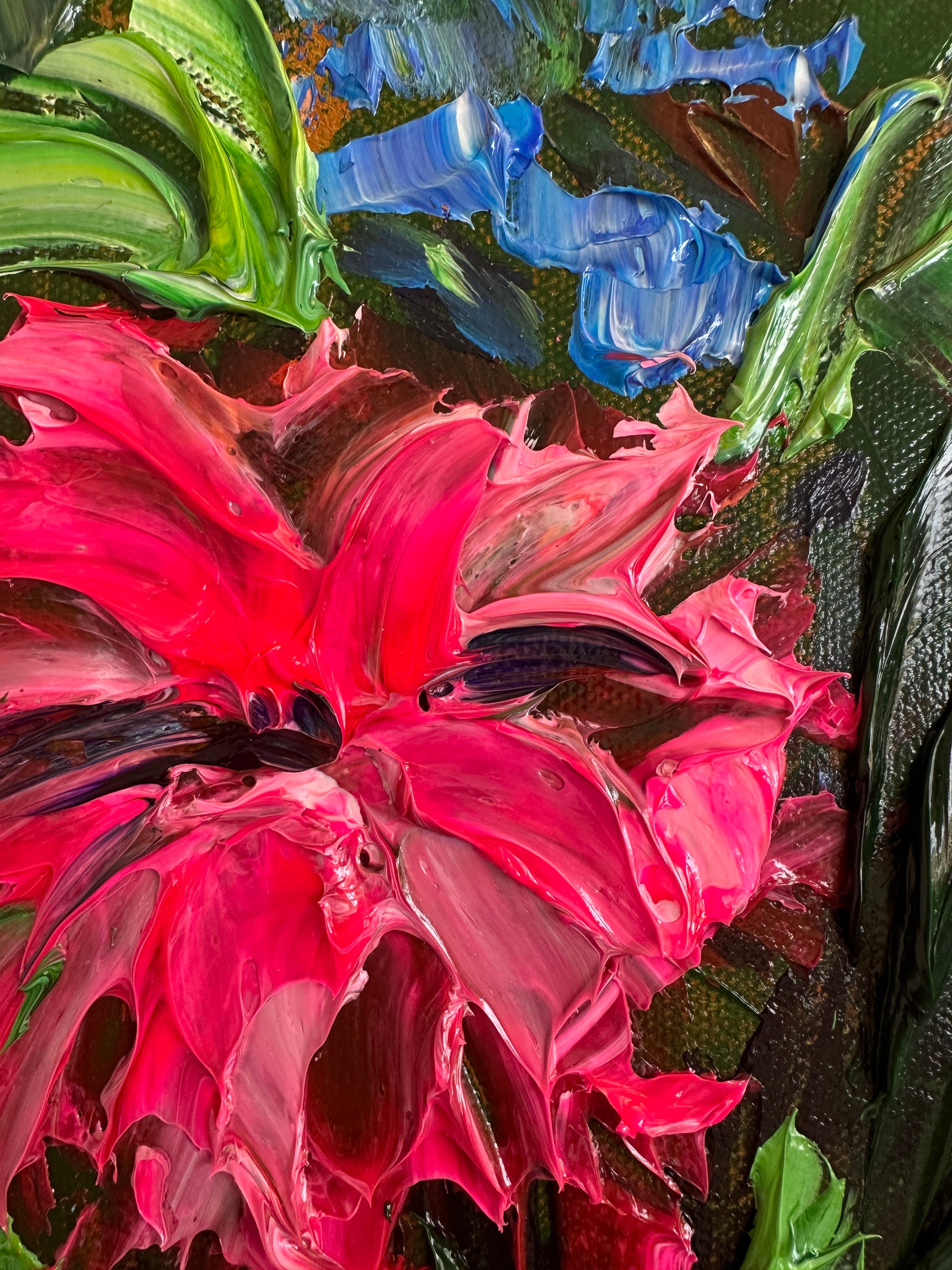 Close-up of a palette knife impasto painting of a  pink flower with green leaves on a textured background