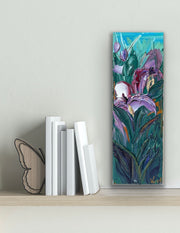 Palette knife painting of iris flowers on a shelf with books and a butterfly decoration.