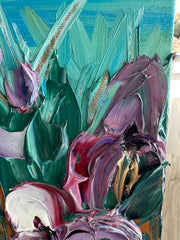 Close up of a palette knife painting with swirling colors on a textured surface