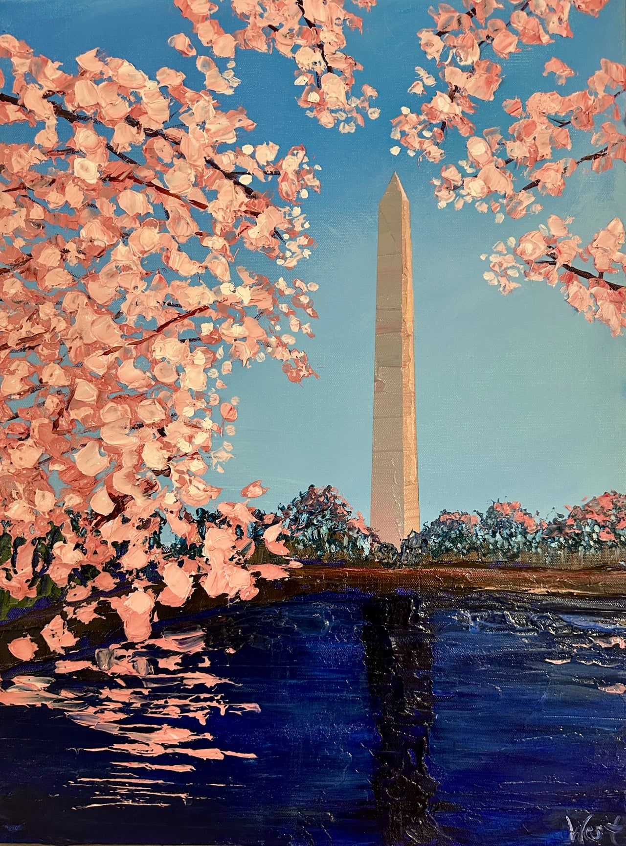 Washington Monument with cherry blossoms in the foreground