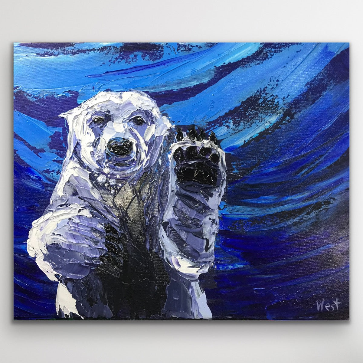 Painting of a polar bear cub against a blue abstract background