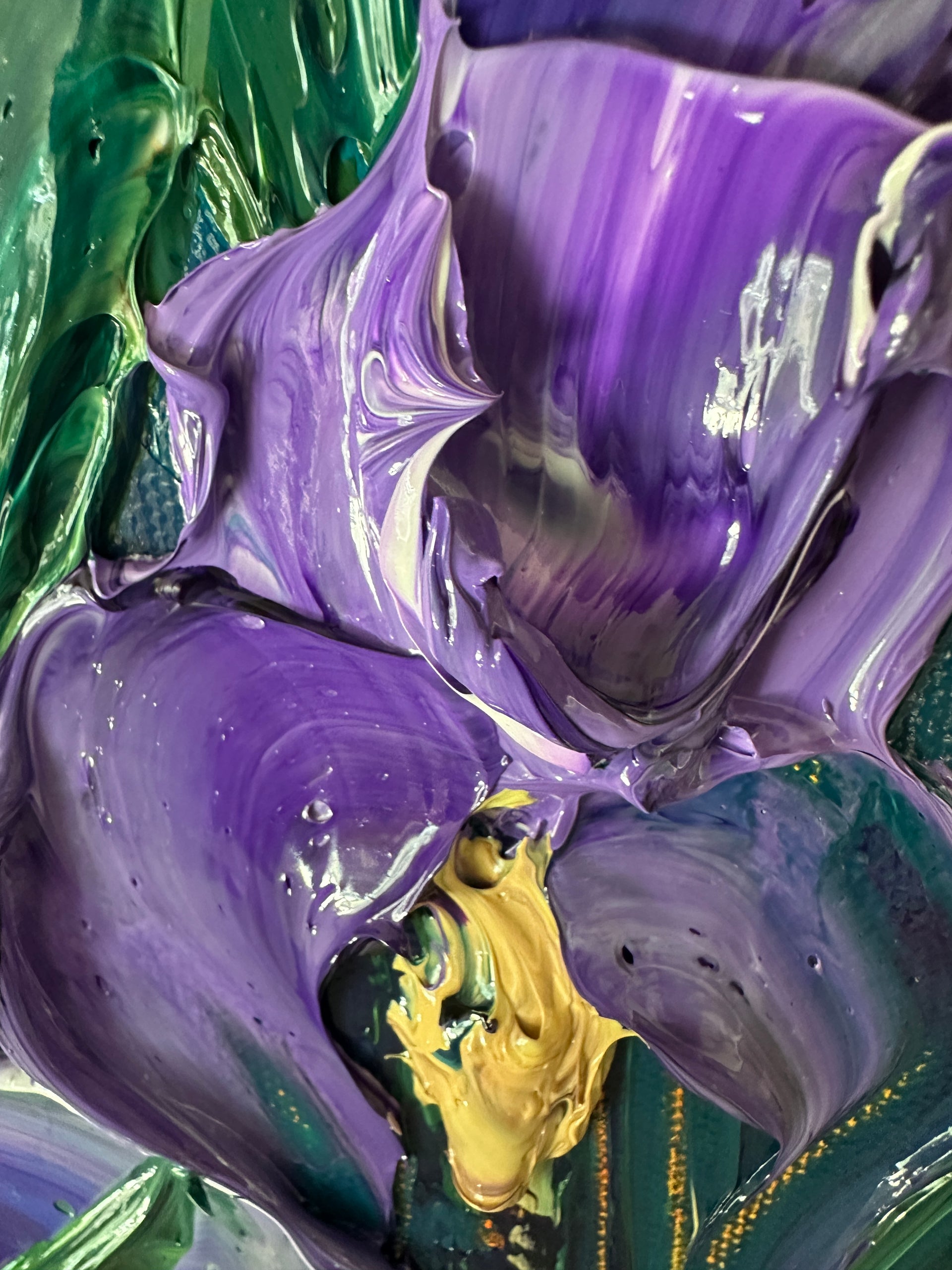Close-up of a palette knife textured surface with purple and green colors