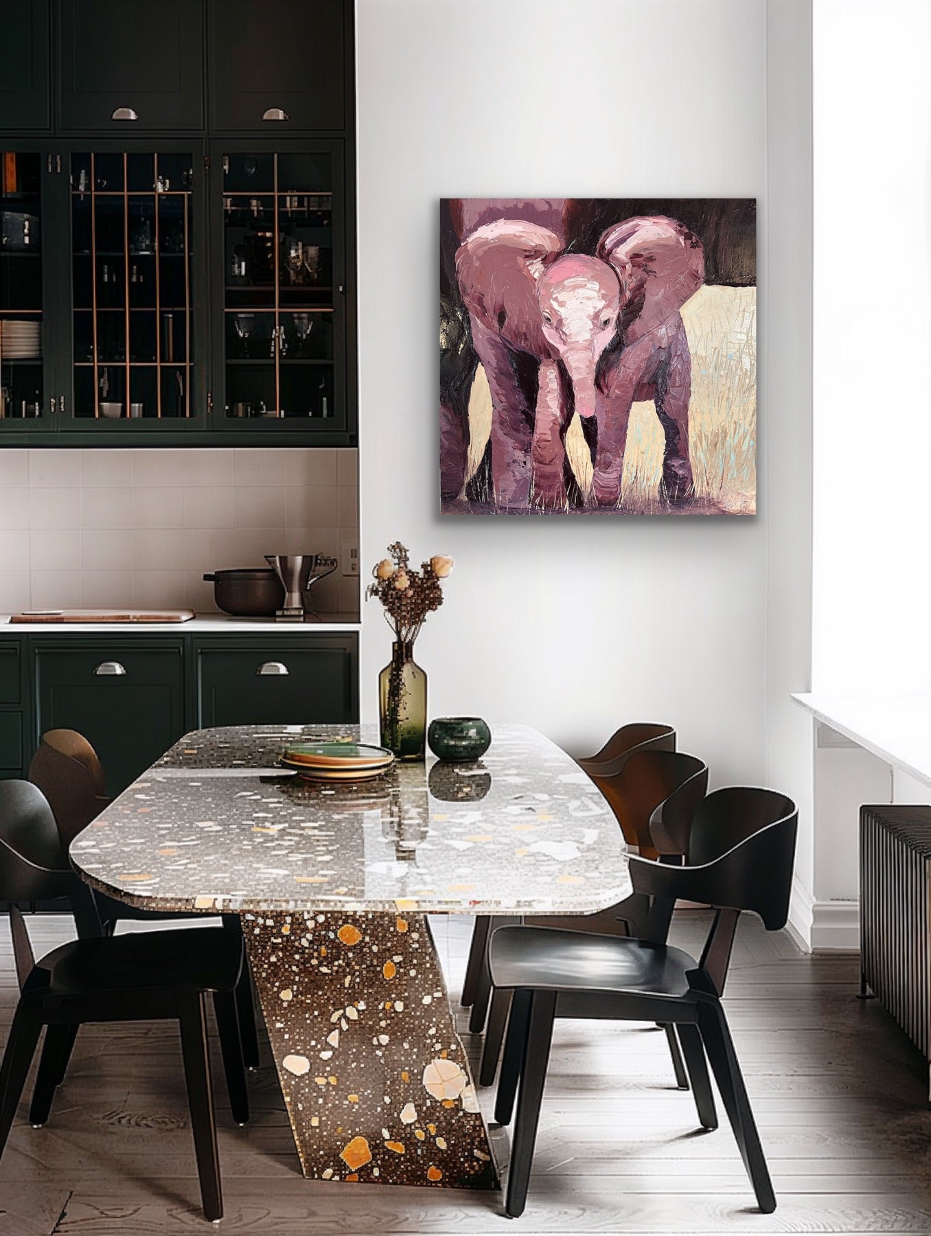 Dining room with a marble table and black chairs, featuring a painting of two elephants on the wall.