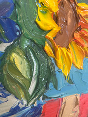 Close-up of a colorful palette knife painting with swirling colors and extreme texture